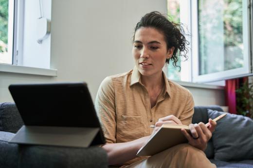 Woman taking part in a telehealth counseling session via a tablet