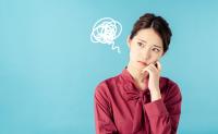 Girl thinking about future with worrisome scribble near her head